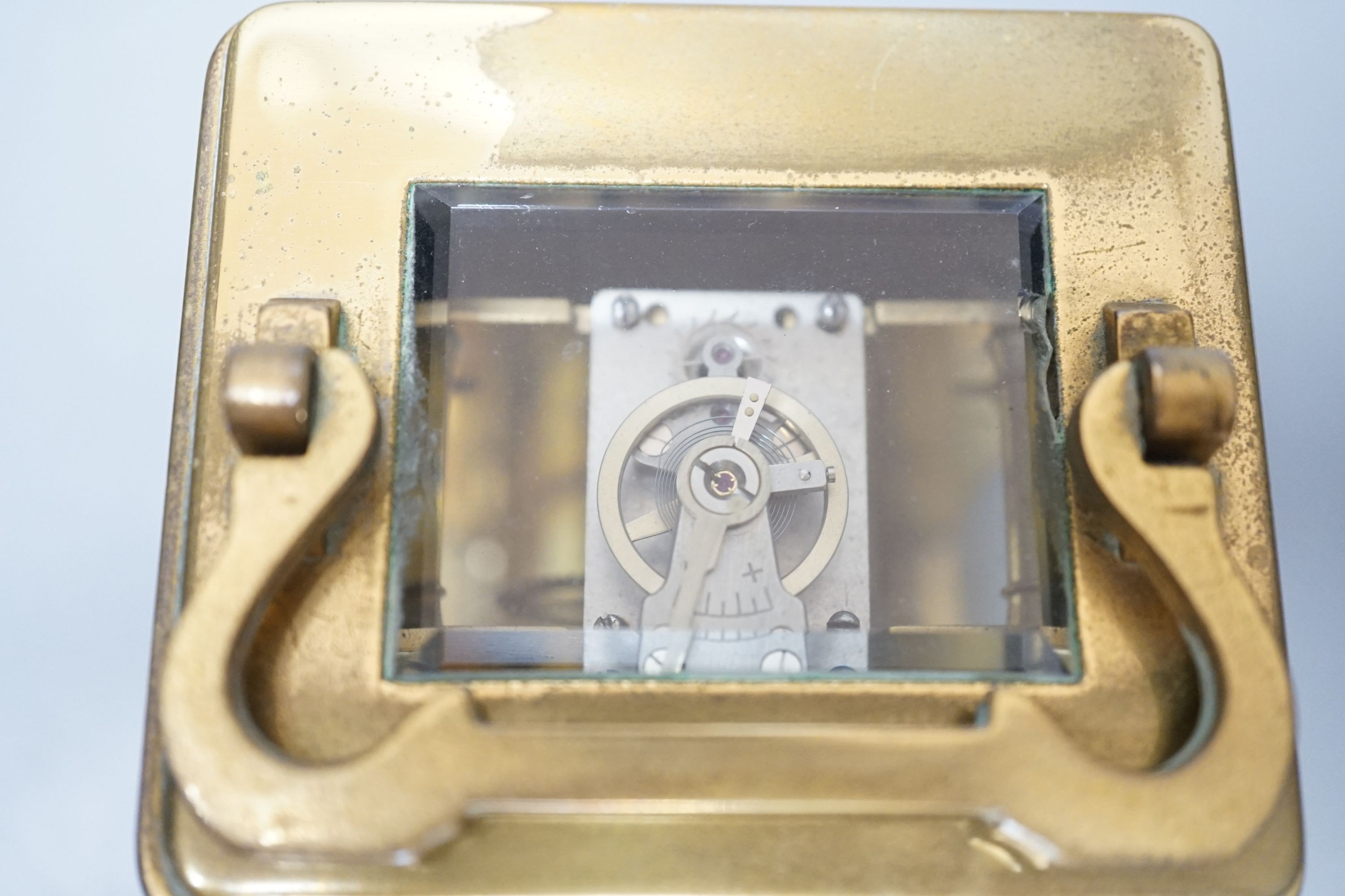 A brass cased French eight day carriage timepiece, 12cm high with key. *This lot is being sold in aid of the charity Prostate Cancer UK with 100% of the hammer price going to the charity”